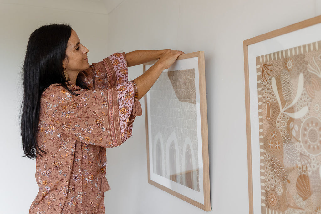 Aboriginal artwork by Wiradjuri artist Lauren Freestone, featuring mustard flame-like shapes symbolising generations, family, and ancestral spirit